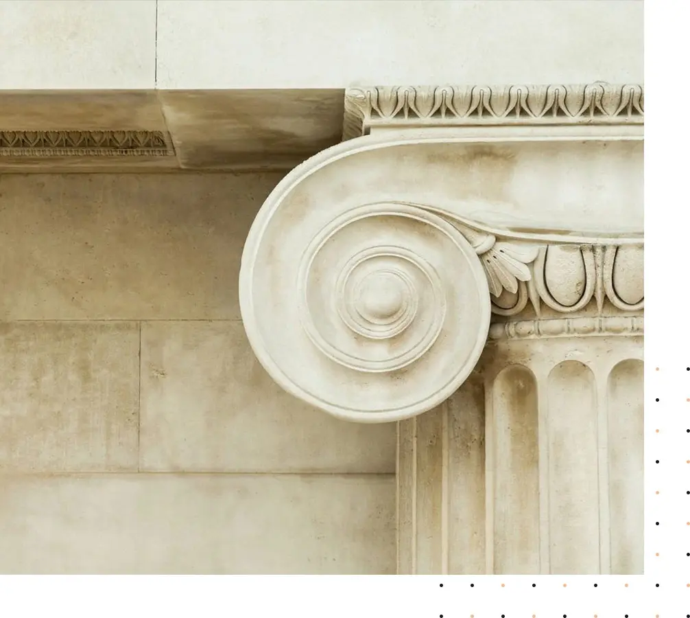 A close up of the top of an architectural column.